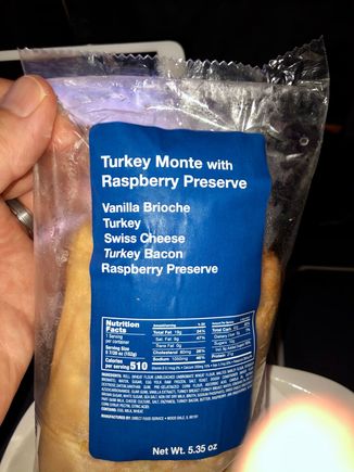 Most in the class went with United's Economy Tapas box for their snack where as I chose a warm Turkey Monte with Raspberry Preserve - which was actualy very tasty. 

Easy 3 hour flight.  Service was quite good lead by our purser, Abbey. We were checked on frequently throughout the flight and provided mini Dasani water bottles as needed. 