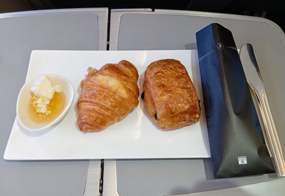 Some breakfast pastry items with honey 