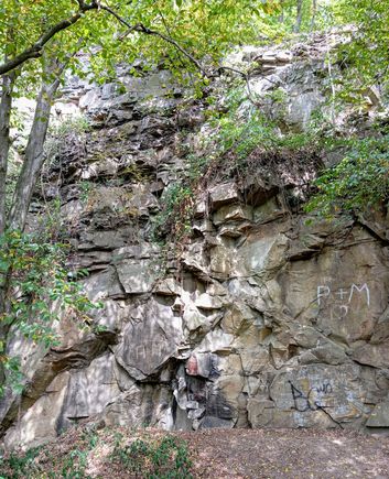 Some parts of the natural rockface are used by climbing teams
