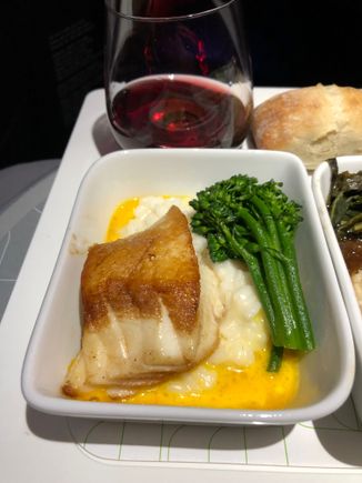 Pan-seared Seabass: parmesan risotto, broccolini, carrot-chardonnay sauce. Quite the dichotomy - the bass was top 10 in-the-air US carrier fish; the risotto and the sauce were awful.