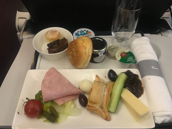 LGW Band 2 Afternoon Tea flight. The LGW Ploughmans remains a sad, tasteless plate, though at least scones with jam and clotted cream are restored. For those interested, the butter was English and salted.