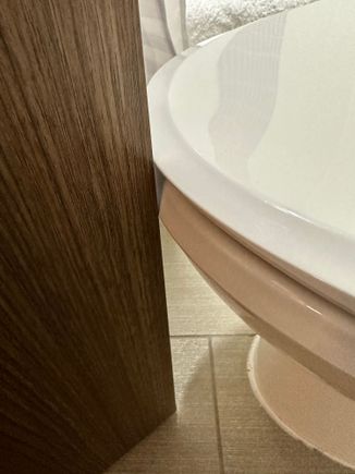 Toilet seat would move when door is closed/opened 