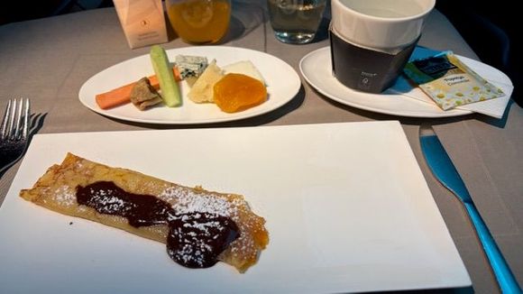 Cheese and apricot crepes with chocolate sauce