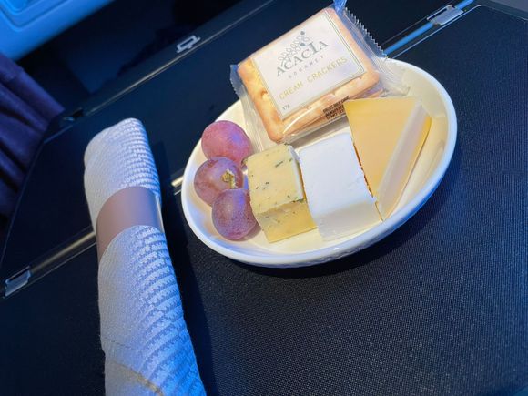 They had some leftover cheese plates on the shelf, so I grabbed one a few hours before landing.