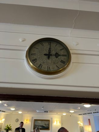 One of the clocks, all of which are stopped at one minute past three.