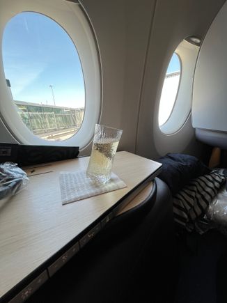 Welcome champagne.  Another glass as the drink after takeoff came with salted nuts. 