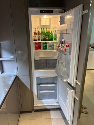 Very good size fridge, with bottom freezer and mini bar items.