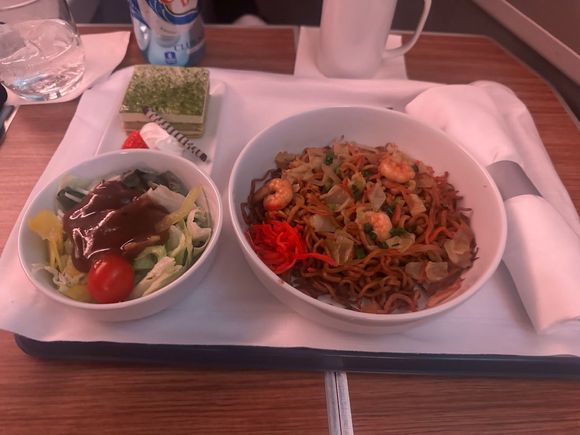 Pre-arrival meal served about 70 minutes out. Alternative was an omelette for “breakfast”, which my wife ordered and was better than the noddle plate. 