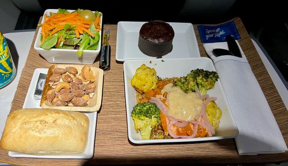 Salmon bowl was tasty as others have reported. Nuts and roll were both warm, chocolate cake was not warmed but still yummy.  Everything on one tray and snack basket never appeared.