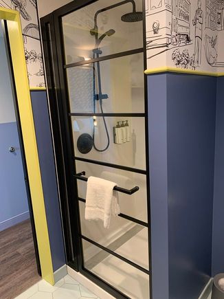 No shelf to set toiletries in the shower, but otherwise excellent with both rain and handheld showerheads (although they couldn't be used simultaneously).