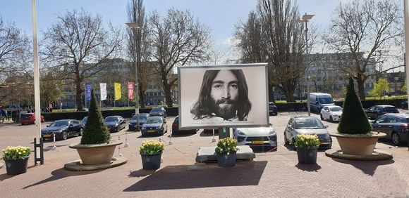 Several huge billboards in front of hotel announcing the event.