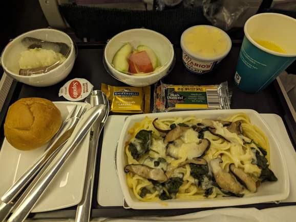 Linguine with white wine cream sauce and permesan cheese, sauteed spinach, shiitake mushroom