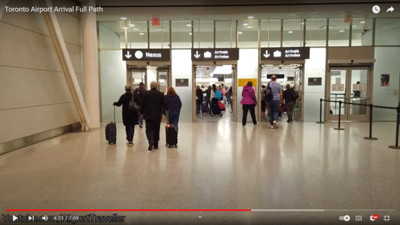Base of escalator into immigration