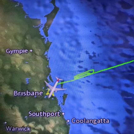 Glory be, we have done the requisite number of loops, but to BNE it is because SYD has a curfew. 

I watched Cocaine Bear to pass the time. Riotously funny when you're half-pissed on G+Ts. The crew happily topped me up and they handled things very well, particularly the grumpy pax.

It was pretty awesome to be doing circuits at 10,000ft at high throttle. I noted some lights which I presumed to be ships in the Tasman Sea, so I hope they weren't too concerned about what they may have seen. 