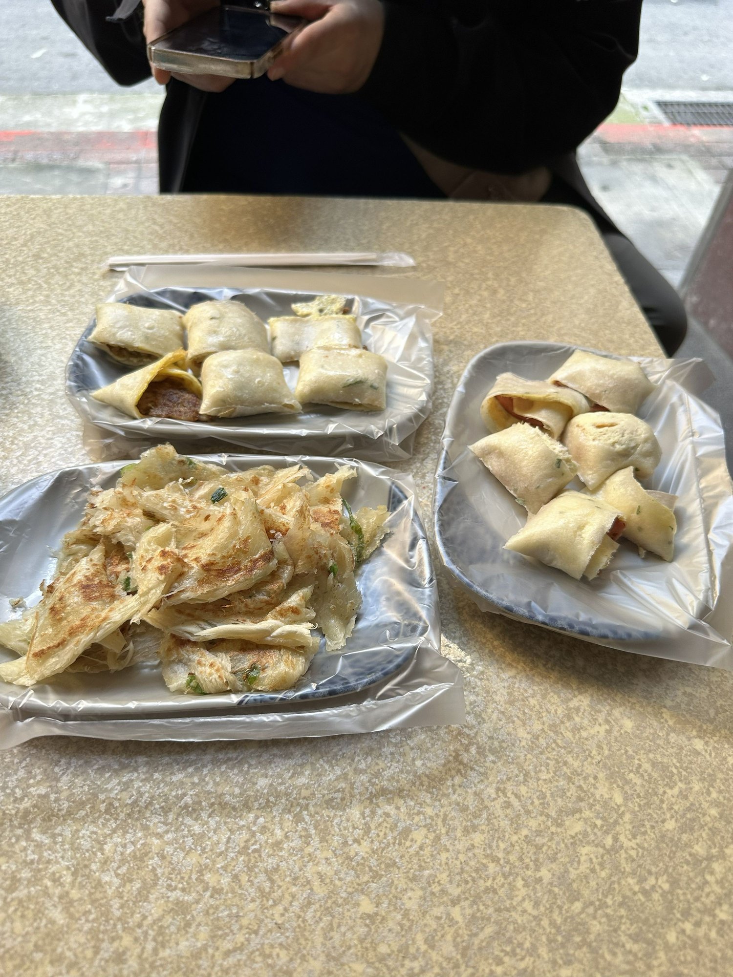 Pancake with egg and bacon, pancake with egg and sausage, and scallion pancake