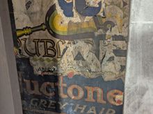 Old advertising poster in a now closed tube station