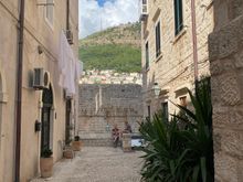 Walking toward the Wall along Bandura. Our apartment entrance is on the right, below the sheets! 