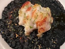 Monkfish on ink rice