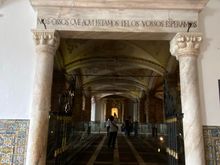 The inscription over the doorway reads “We bones that are here await tours”!