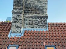 Looking at Sam in the bathroom window across the courtyard from the bedroom window. 