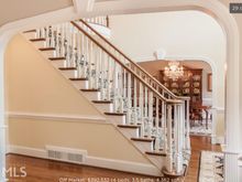 
Nice center hall with a pretty staircase.