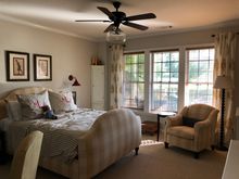 
This room overlooks a patio with a stone retaining wall and out onto the golf course.  It gets great westerly light in late afternoon. 