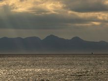 Cloud building over Rum from ferry