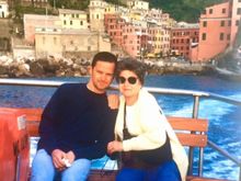 Leaving Vernazza by boat (right before mom put her scarf around her head to hold on her wig). 
