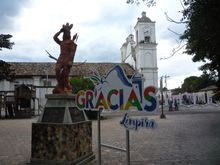 From the central plaza:  in the background, San Marcos church; and in the foreground, the Lenca war leader Lempira, who led the local resistance against the Spanish conquistadors. 
