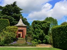  At Hidcote, we lay on the lawn beneath a massive holm oak. This pavilion was a convenient shelter for all of us visitors during the brief rain shower. It was interesting to see how different tourists behaved towards one another squashed in there, after hours of assiduously trying to avoid any eye contact with each other onsite!