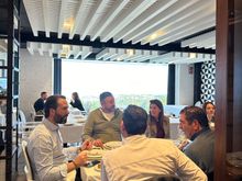 Diners in main dining room, offering marvelous sea views (better during daylight)
