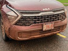 Our car after attempting the muddy red road