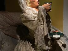 Only the rich drank chocolate of course, this woman was riding in a carriage.