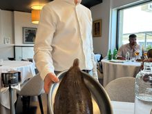 Our courtly and welcoming waiter presenting the lenguado (Dover sole) that we chose to share