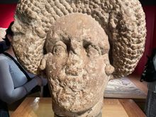 Large bust of woman with the latest hair do...at that time.