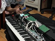 Grandad doing more instrument repair work, this time for one of Adrienne’s friends.