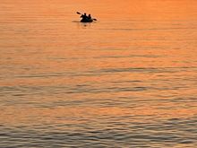 Lots of people on the bay, kayaking and paddle boarding.  As it turned out, this couple was staying at our resort and I was able to forward this picture to them!