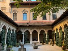 Stone cloister with columns and arhces