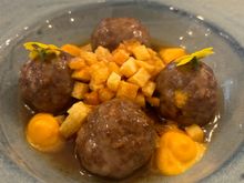 Duck meatballs with carrot purée and fried potato bits