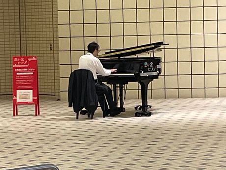 When I'm in the giant, spotless, bigger than a hallway, space, I'm hearing Chopin.  I get a little closer and there is an actual grand piano and some guy is playing Chopin. It's 8 in the morning!  Chopin didn't even get up before 10 o'clock