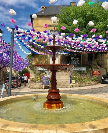 Jump, thanks for posting your incredible photos! You’ve made me miss being there more than ever. Another festival that’s worth seeing on a future trip to the Dordogne is the Félibrée, which celebrates Occitan culture and music in a different town each year in the Dordogne in early July, as it has every year since 1903. Even if you miss the festival, the paper flower garland décorations remain up all summer. Here’s a pic from St-Cyprien, where it took place in 2018. 