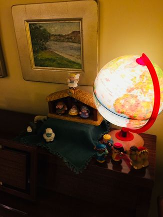 Molly hanging out in the rocker. The tree. And my daughter’s nativity set. If you look closely there is a polar bear. She used to add a whole menagerie when she was little: giraffes, cats, dogs, a bear, elephant, etc. I still throw the polar bear in for old time’s sake. 