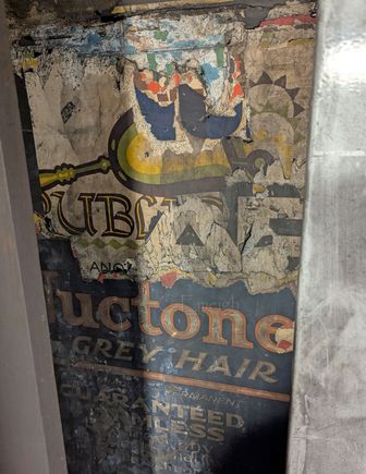 Old advertising poster in a now closed tube station