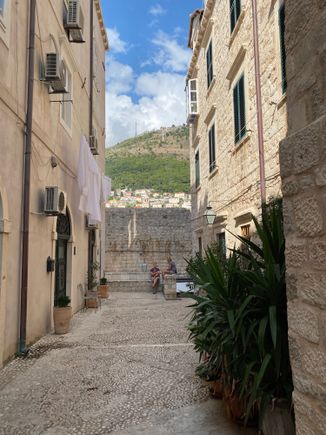 Walking toward the Wall along Bandura. Our apartment entrance is on the right, below the sheets! 