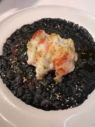 Monkfish on ink rice