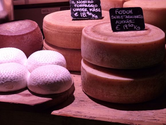 Cheeses and speck stored in cellar