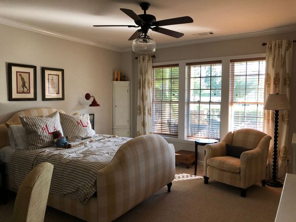 
This room overlooks a patio with a stone retaining wall and out onto the golf course.  It gets great westerly light in late afternoon. 