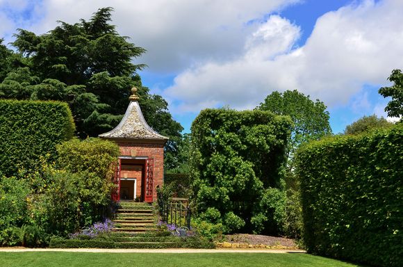  At Hidcote, we lay on the lawn beneath a massive holm oak. This pavilion was a convenient shelter for all of us visitors during the brief rain shower. It was interesting to see how different tourists behaved towards one another squashed in there, after hours of assiduously trying to avoid any eye contact with each other onsite!