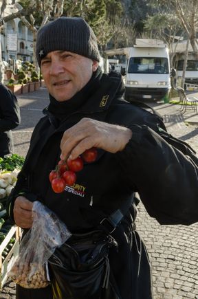 We shopped at the modest Minori market twice in two weeks. It was located on the lungomare and as with other such markets, was a mix of food plus clothing vans and such. Celebrity chef Luigi Cerri was curious about that (we were the only tourists there) and approached for a chat. Without prompt, he posed with tomatoes for a photo.