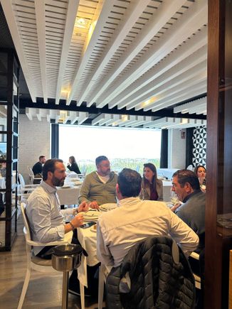 Diners in main dining room, offering marvelous sea views (better during daylight)